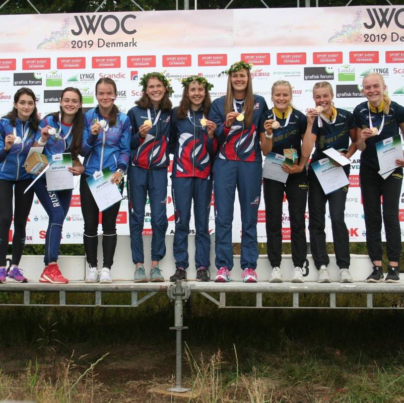 On the podium in 1st place!  Photo credit: IOF / JWOC 2019