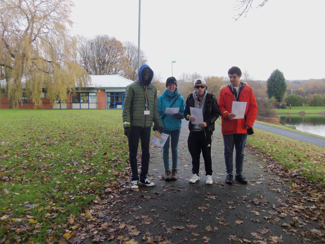Students attending an orienteering session in the park.