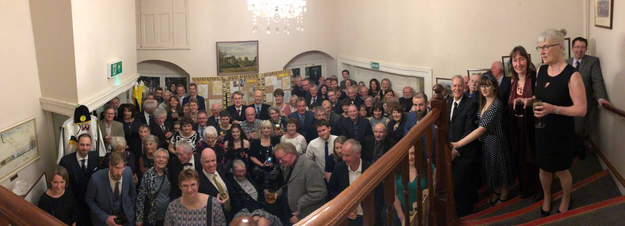 Group photo taken at the club dinner of members past and present.